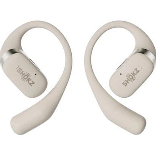 Beige Shokz OpenFit true wireless earbuds featuring a flexible, lightweight open-ear hook design with silver accents.
